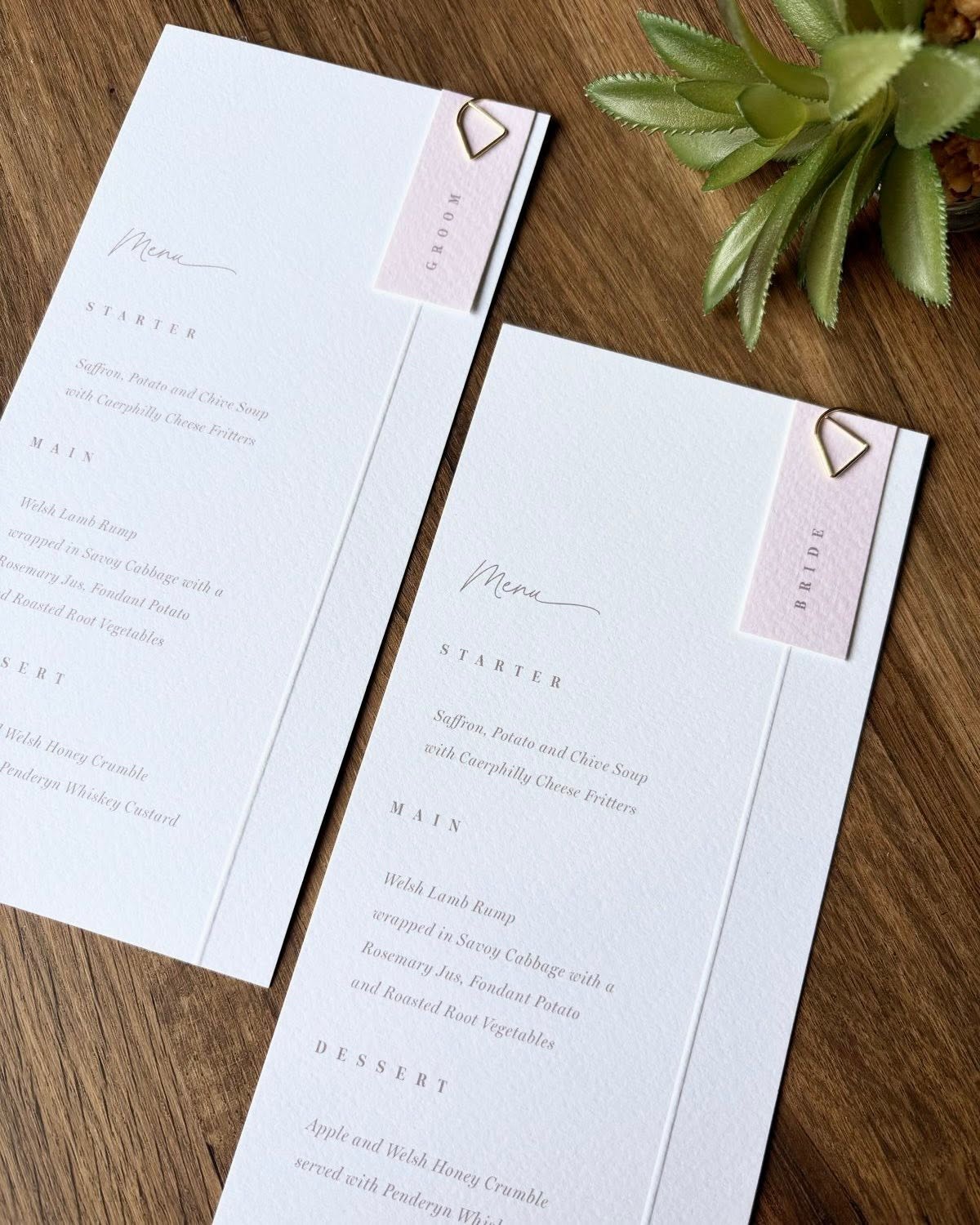 Personalised wedding menus with decorative paper clips